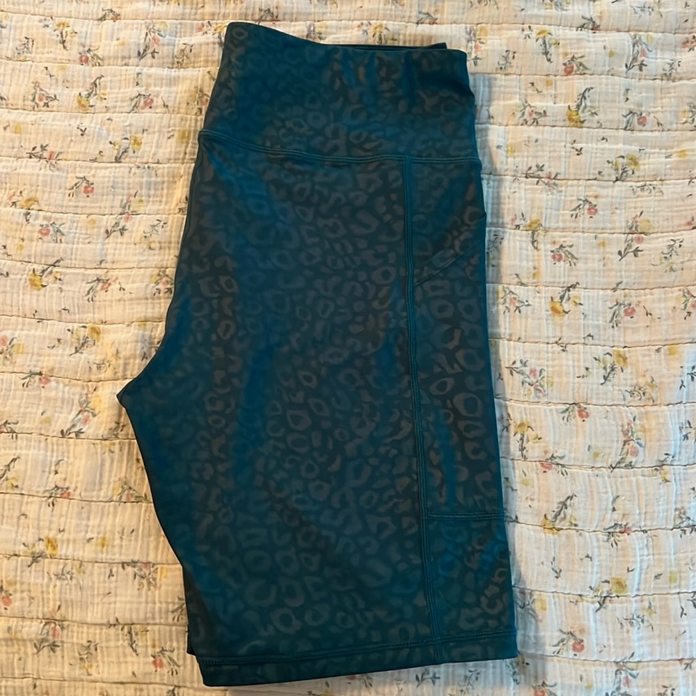 Kiava 8” biker shorts w/ leg grips. Stealth cheetah print. Limited jade green
